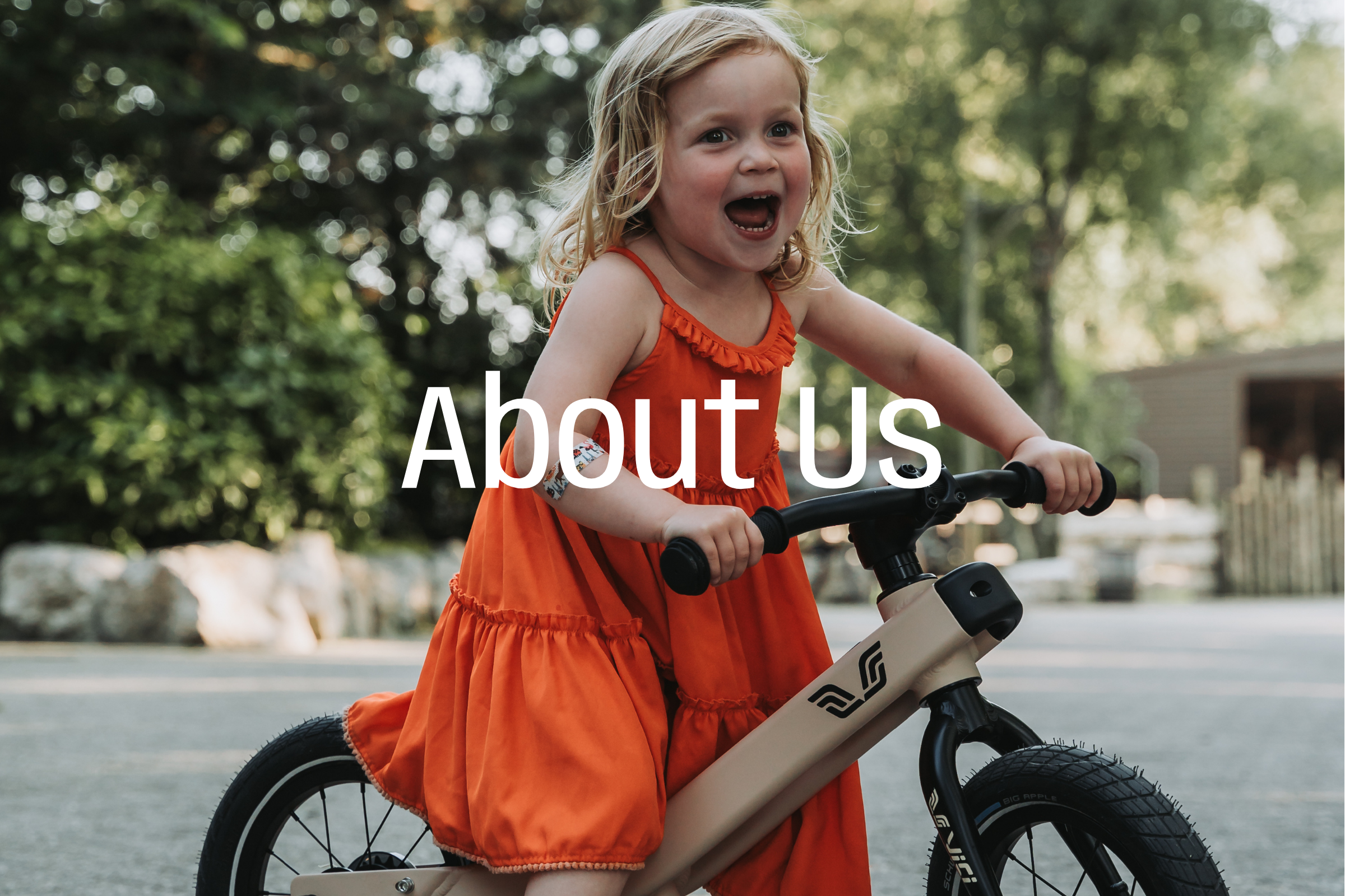 Young child riding TokTok adjustable kids bike outdoors