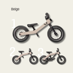 Beige balance bike with black wheels on a light beige background